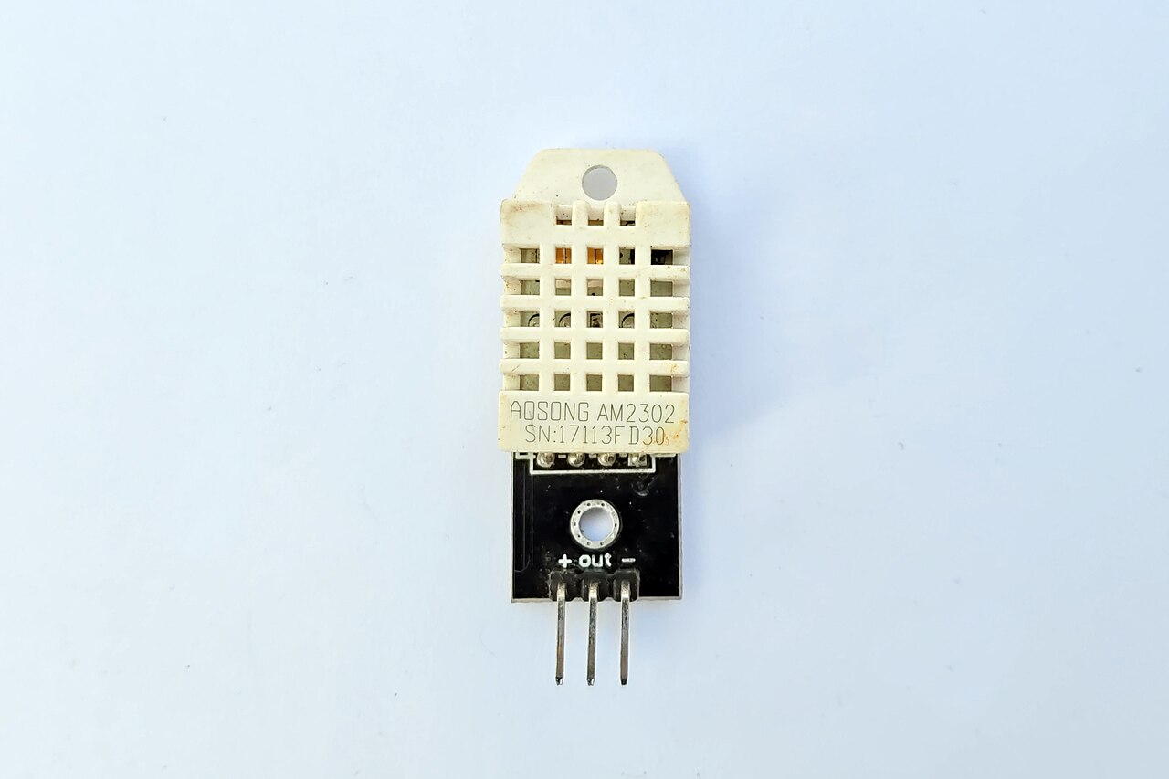 Aosong AM2302 DHT22 temperature and humidity sensor module on a black breakout board